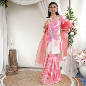 Printed suit with hand embroidered highlight details paired with layered gharara & organza dupatta